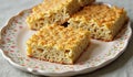 Square pieces of noodle kugel with crumb topping on a decorative plate Royalty Free Stock Photo