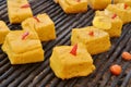 Polenta pieces grilled on embers