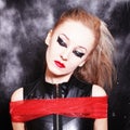 Square portrait of young woman with gothic makeup