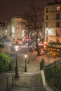 Square on the rue Maurice Utrillo at night