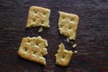 Square saltine cracker is broken into four random pieces