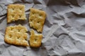 Square saltine cracker is broken into four random pieces