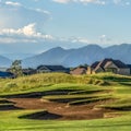 Square Scenic view of a golf course and residential area under blue sky on a sunny day Royalty Free Stock Photo