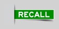 Square seal green sticker in word recall insert on gray background