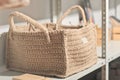 square shape jute knitted basket for natural storage on a shelf. eco knit item, hobby and leisure. natural home interior