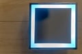 Square shape mirror with LED light mounth on white wall in restroom. Square mirror in the bathroom Royalty Free Stock Photo