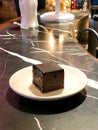 Square Shaped Mini Brownie at Cafe Shop as Appetizer with Coffee.