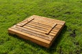 A square-shaped playground made of a wooden closed box, the box is closed. Royalty Free Stock Photo