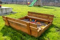 A square-shaped playground made of a wooden closed box, the box is open. Royalty Free Stock Photo