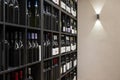 Square shelves filled with lots of red wine bottles