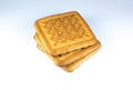 Square shortbread biscuits on the white background with ornament on it. Pile of cookies, warm home food photo photo, instagram