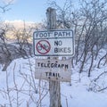 Square Signages at the Telegraph Trail of Wasatch Mountains buried in snow in winter