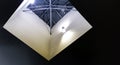 Square skylight illuminated by wall lights. Modern architectural detail Royalty Free Stock Photo