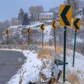 Square Snowy road with directional road signs in winter Royalty Free Stock Photo