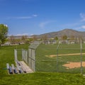 Square Softball or Baseball field with view of mountain and sky on a sunny day Royalty Free Stock Photo