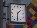 A square street clock shows one hour thirty minutes Royalty Free Stock Photo