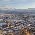 Square Sunset in Utah Valley with homes on a snowy neighborhood with mountain view