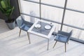 Square table in gray cafe interior, top view Royalty Free Stock Photo