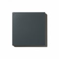 A square tile with a matte, dark gray surface is centered on a white background. The tile Royalty Free Stock Photo