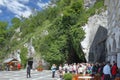 Postojna, Slovenia - Jun 26, 2011: Square and tourists at entrance to cave `Postojnska jama`