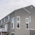 Square Townhouses exterior with small balconies at the facade in South Jordan Utah