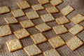 Square treats on burlap background Royalty Free Stock Photo