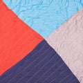 Square from triangles in stitched patchwork quilt Royalty Free Stock Photo