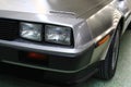 Square twin headlights on front mask of classical US two passenger sports car DeLorean DMC-12