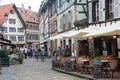 Square with typical architecture of Alsace region in Strasbourg at the Ill river, France