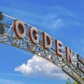 Square The welcome arch in Ogden Utah against vibrant trees and towering mountain