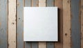 Square white canvas on wooden background for artwork. Top view of a blank white canvas. Wooden texture table with mockup for art Royalty Free Stock Photo