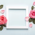 Square white frame and pink roses on blue background. Beautiful flower arrangement for your design Royalty Free Stock Photo