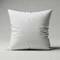 Square white pillow with a smooth texture, slightly creased, placed against a neutral Royalty Free Stock Photo