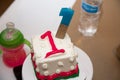 A square white and pink 1st birthday cake Royalty Free Stock Photo