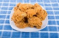 Square White Plate of Fried Chicken on Blue Towel Royalty Free Stock Photo