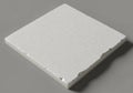 A square, white polystyrene foam tile with a textured surface and Royalty Free Stock Photo