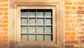 Square window with iron grating Royalty Free Stock Photo