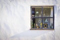 Square window with knickknacks in window Royalty Free Stock Photo