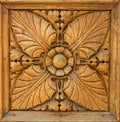 Square wood panel hand carved with flower and plant shapes