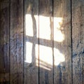 Square wooden background with light shining through a window Royalty Free Stock Photo