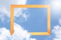 Square wooden frame, Creative Beautiful blue sky with white clouds for background . with paper card note.