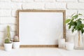Square wooden photo frame and cactus plants on the table Royalty Free Stock Photo
