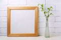 Square wooden picture frame mockup with birch branches