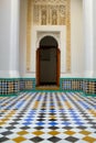 Squared colourful tiles floor on an ancient historic building gate in Arabian style in Marrakesh, Morocco