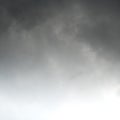 Squared image of beautiful gradient sky with dark clouds. Copy space for text