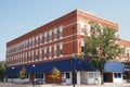 This is a squared off type of building in Cheyenne, Wyoming. The skies are blue and nobody is around.