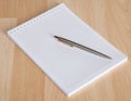 Squared paper loose-leaf note sheet and pen Royalty Free Stock Photo