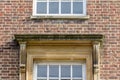 Squared Pediment above Window in Brick Wall