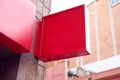 Squared red front store signboard mock-up on building wall outdoor.