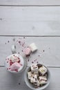 Squares of cranberry and pistachio nougat with a mug of hot chocolate and marshmallows Royalty Free Stock Photo